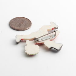 Art Deco hand painted celluloid pin brooch; running Top hat boy with flower bunch red