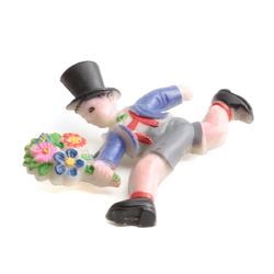 Art Deco celluloid pin brooch; running Top hat boy with flower bunch hand painted blue grey