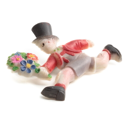 Art Deco hand painted celluloid pin brooch; running Top hat boy with flower bunch red