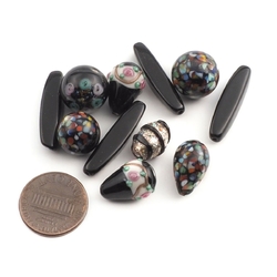 Lot (11) Czech vintage spot overlay lampwork molded black glass beads