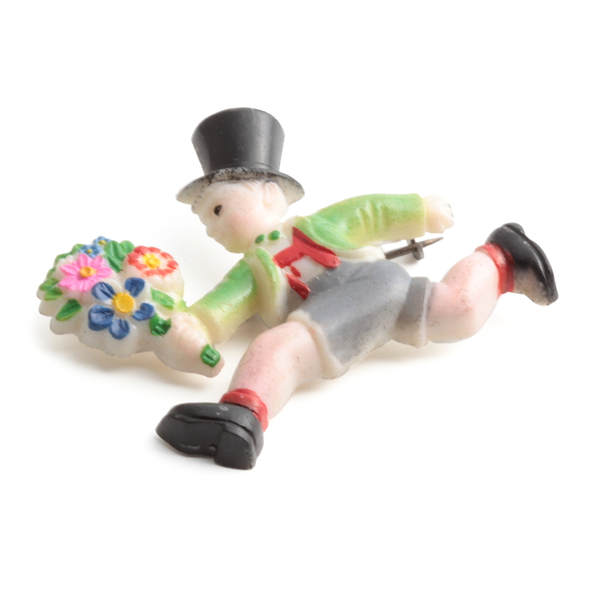 Art Deco running Top hat boy with flower bunch celluloid pin brooch; hand painted green grey