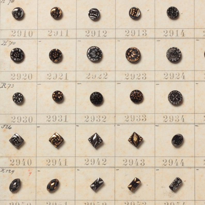 1904 Sample card (150) Czech antique black floral and geometric dimi glass buttons