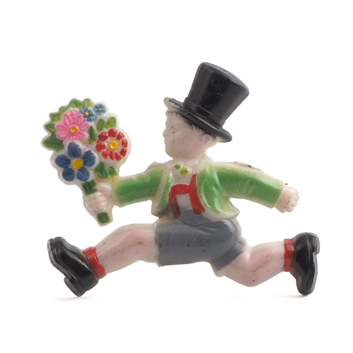 Art Deco antique celluloid pin brooch running Victorian boy with flower bunch