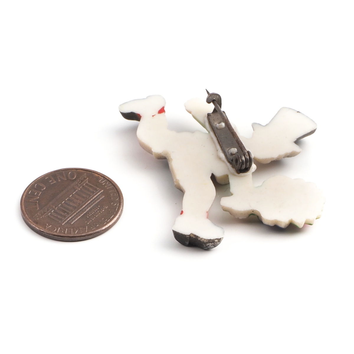 Art Deco antique celluloid pin brooch running Victorian boy with flower bunch