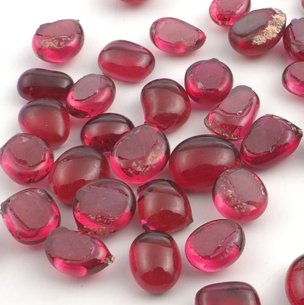 Lot (62) 19th century Czech antique cranberry pink glass cabochon drops