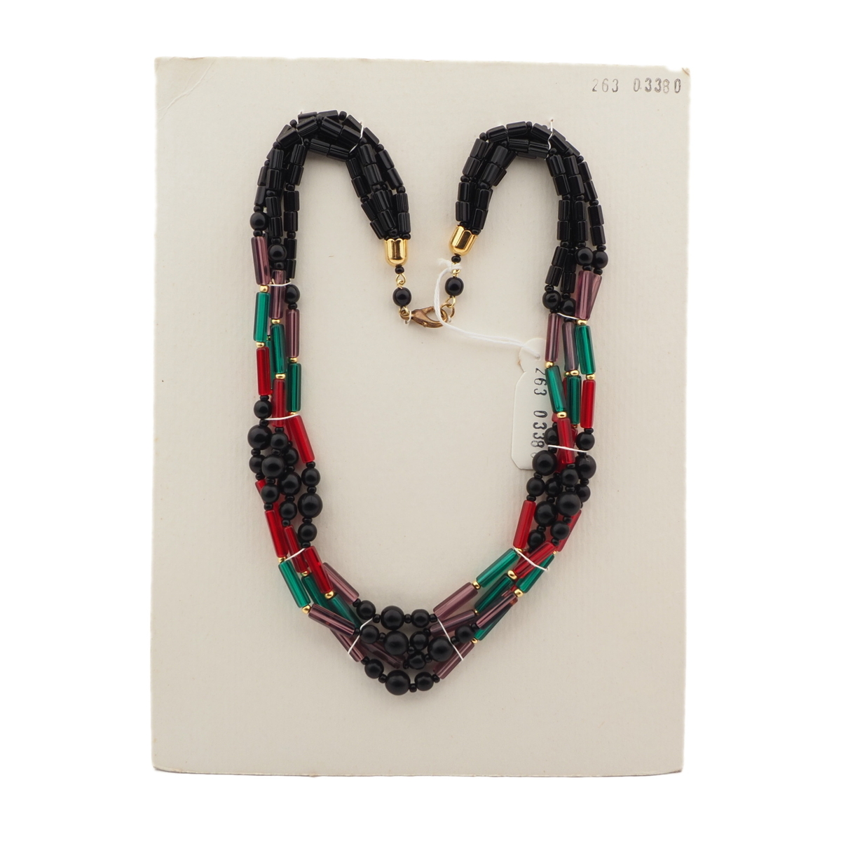 Red black outlet and green necklace